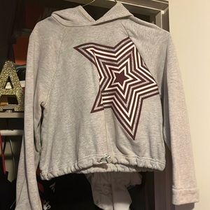 A grey hoodie with a huge star on it! ⭐️✨